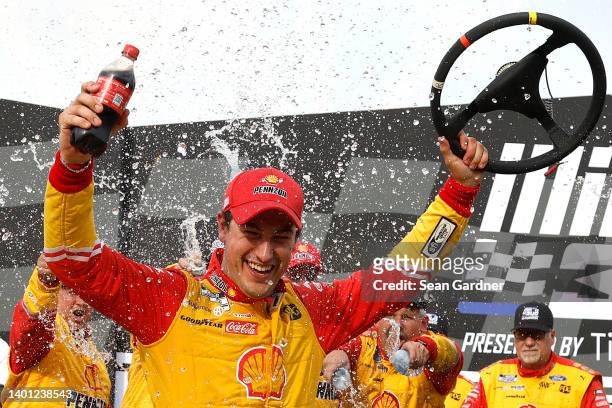 Joey Logano, driver of the Shell Pennzoil Ford, celebrates in victory lane after winning the NASCAR Cup Series Enjoy Illinois 300 at WWT Raceway on...