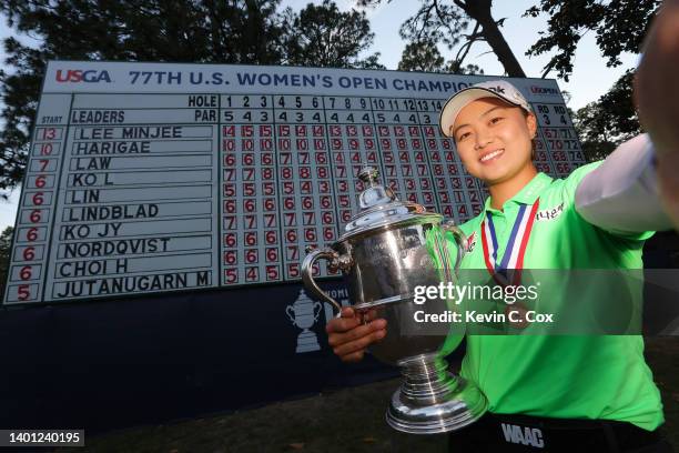 Minjee Lee of Australia pretends to take a selfie while holding the trophy after winning the 77th U.S. Women's Open at Pine Needles Lodge and Golf...