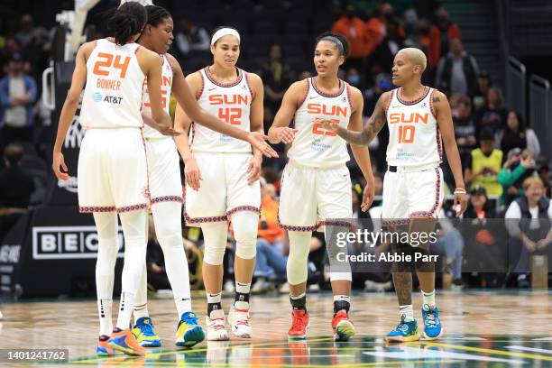 DeWanna Bonner, Jonquel Jones, Brionna Jones, Alyssa Thomas and Courtney Williams of the Connecticut Sun embrace during the fourth quarter against...