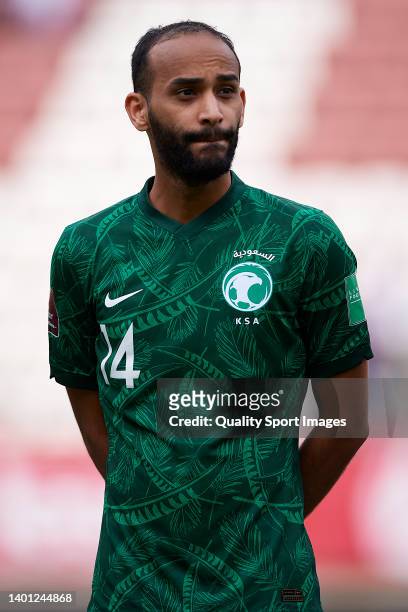 Abdullah Otayf of Saudi Arabia looks on during the national anthem prior to the international friendly match between Saudi Arabia and Colombia at...