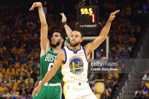 Jayson Tatum of the Boston Celtics shoots past Stephen Curry of the Golden State Warriors during the first quarter in Game Two of the 2022 NBA Finals...