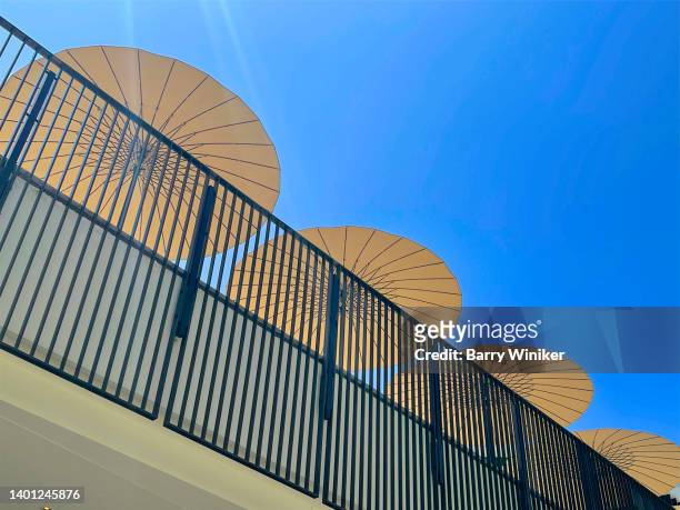 looking up at sun umbrellas, century city, los angeles - beverly hills restaurant stock pictures, royalty-free photos & images