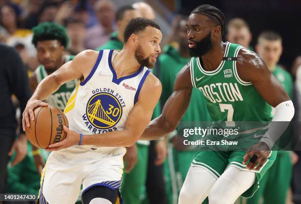 Jaylen Brown of the Boston Celtics guards Stephen Curry of the Golden State Warriors during the first quarter in Game Two of the 2022 NBA Finals at...