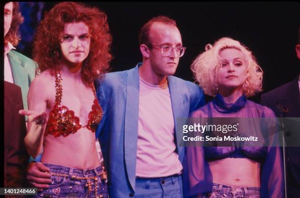 View of, from left, American actress & performer Sandra Bernhard, artist Keith Haring , and singer & actress Madonna as they attend the 'Don't Bungle...