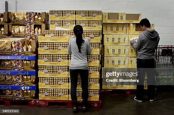 Customers shop for Ferrero SpA Rocher chocolates at a Costco Wholesale Corp. Store in the Brooklyn borough of New York, U.S., on Monday, Feb. 27,...