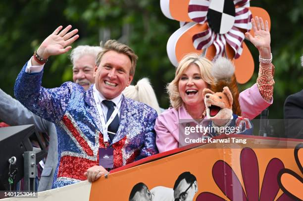 Michael Winsor and Anthea Turner ride a bus during the Platinum Pageant on June 05, 2022 in London, England. The Platinum Jubilee of Elizabeth II is...