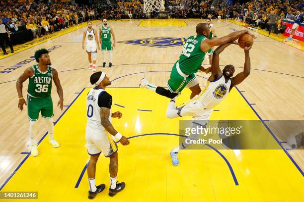 Al Horford of the Boston Celtics blocks a shot by Draymond Green of the Golden State Warriors during the first half in Game Two of the 2022 NBA...