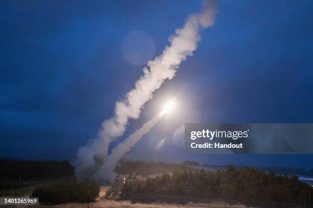 In this handout image released by the South Korean Defense Ministry via Dong-A Daily, a missile is fired during a joint training between the United...