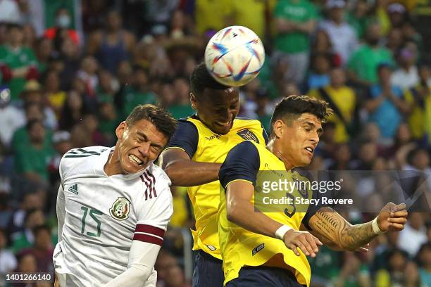 Hector Alfredo Moreno Herrera of Mexico works for a ball against Angel Israel Mena Delgado and Piero Hincapie Reyna of Ecuador in the second half of...
