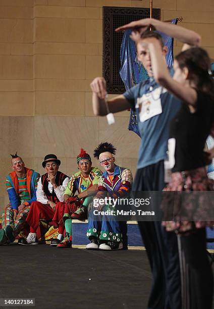 Ringling Bros. And Barnum & Bailey circus clowns watch auditioners perform during "Clown College" auditions at Grand Central Terminal on February 28,...