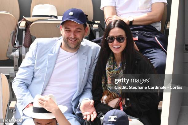 Chef Daniel Humm and Demi Moore with her dog attend the French Open 2022 at Roland Garros on June 05, 2022 in Paris, France.