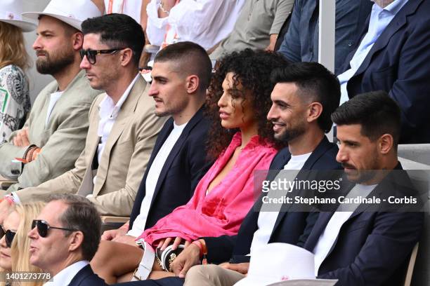 Robert Lewandowski, Marco Verratti and his wife Jessica Aidi an Javier Pastore attend the French Open 2022 at Roland Garros on June 05, 2022 in...