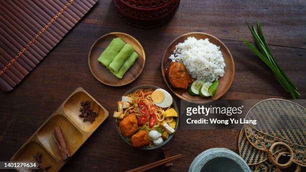 popular malaysian foods , curry noodle, kuih and nasi dagang top down view - traditional malay food stock pictures, royalty-free photos & images