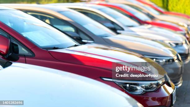 used vw cars parked at a public car dealership - vehicle manufacturers brand names stock pictures, royalty-free photos & images