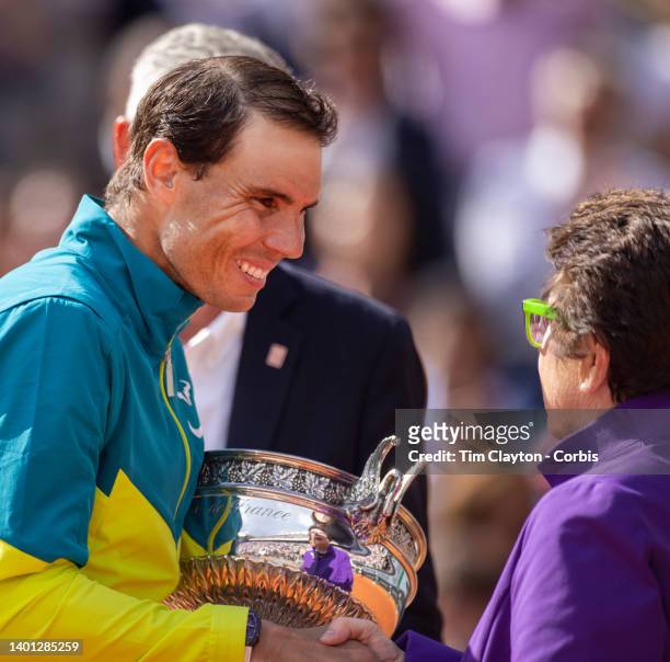 Rafael Nadal of Spain receives the winners trophy from Billie Jean King after his victory against Casper Rudd of Norway during the Singles Final for...
