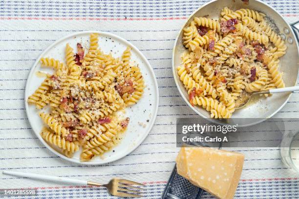 italian food pasta fusilli carbonara - carbonara stock pictures, royalty-free photos & images