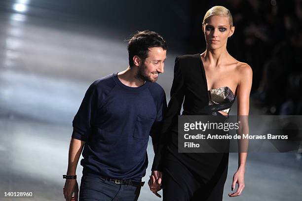 Anthony Vaccarello and Anja Rubik walk the runway during the Anthony Vaccarello Ready-To-Wear Fall/Winter 2012 show as part of Paris Fashion Week at...
