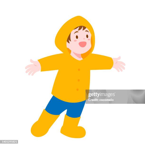 cute boy in yellow raincoat and rubber boots. - yellow raincoat stock illustrations