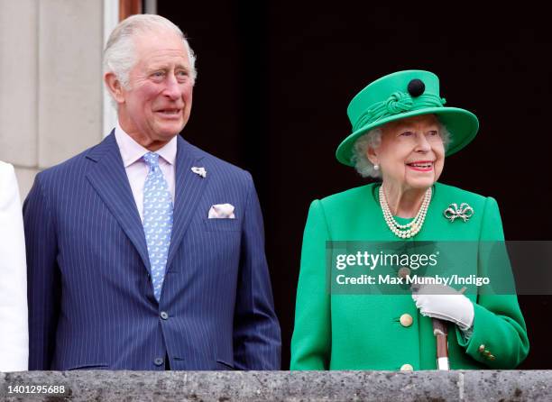 Prince Charles, Prince of Wales and Queen Elizabeth II stand on the balcony of Buckingham Palace following the Platinum Pageant on June 5, 2022 in...