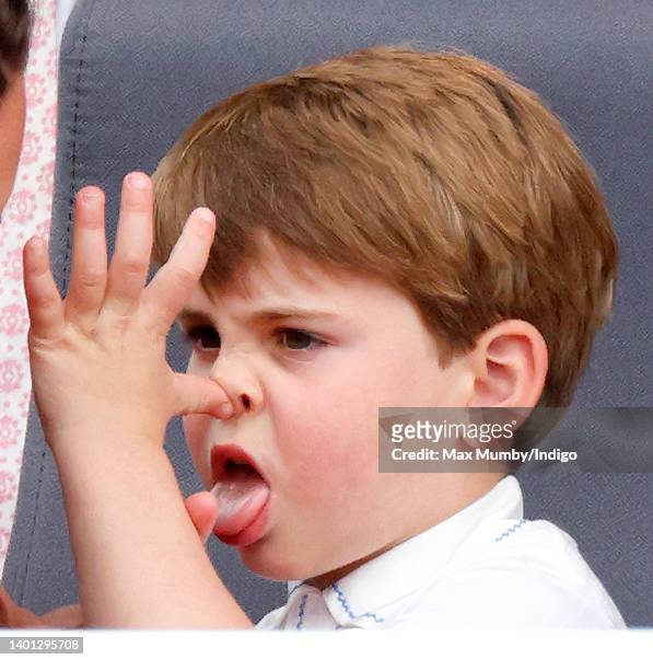 Prince Louis of Cambridge 'thumb's his nose' and sticks his tongue out at his mother Catherine, Duchess of Cambridge as they attend the Platinum...