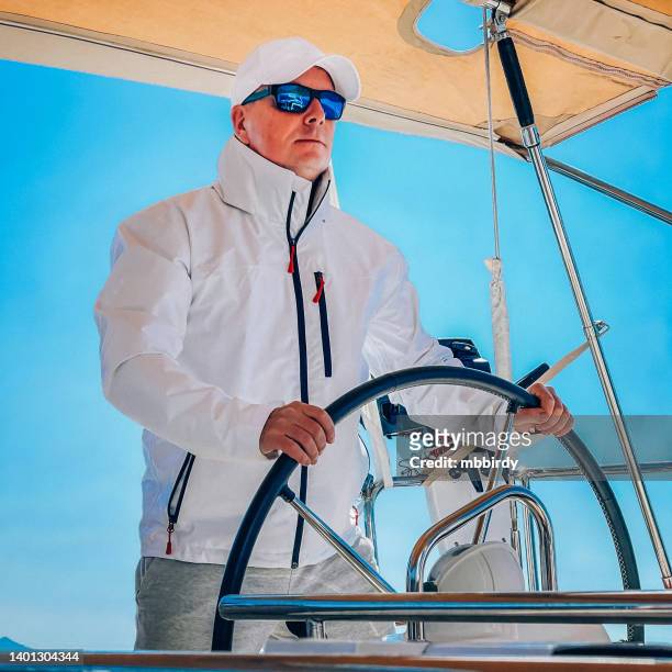 skipper on sailboat - croatia cruise stock pictures, royalty-free photos & images
