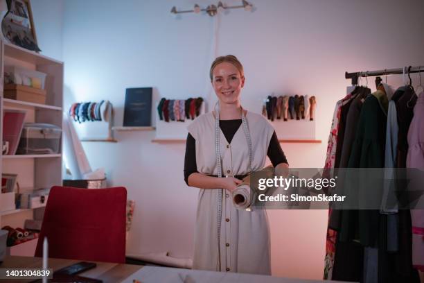 happy fashion designer at her fashion studio - kostymdesigner bildbanksfoton och bilder