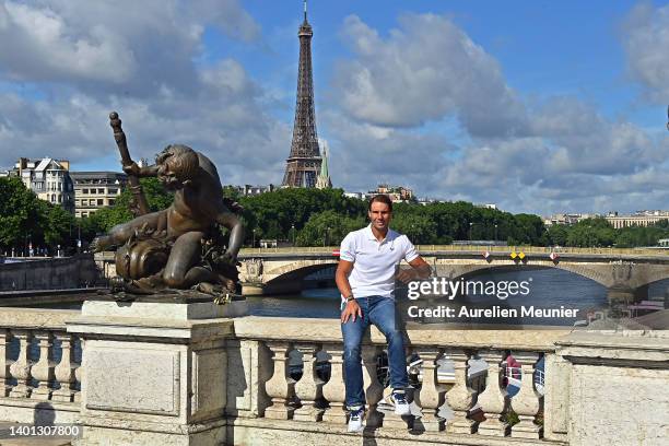 Rafael Nadal of Spain poses with the Musketeers trophy after winning his 14th Roland Garros Grand Chelem tournament on Alexander the 3rd bridge on...