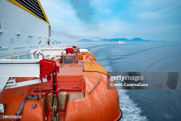 ferry safety equipment - lifeboat close up during navigation - lifeboat stock pictures, royalty-free photos & images