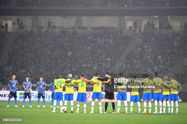 Players and match officials observe moments of silence for late Japan national team head coach Ivica Osim prior to the international friendly match...