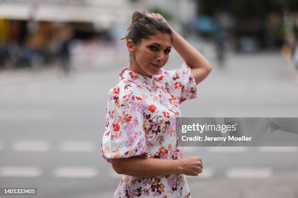 Anna Wolfers seen wearing a white floral button short dress on June 02, 2022 in Hamburg, Germany.