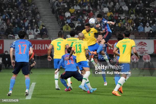 Wataru Endo of Japan and Eder Militao of Brazil compete for the ball during the international friendly match between Japan and Brazil at National...