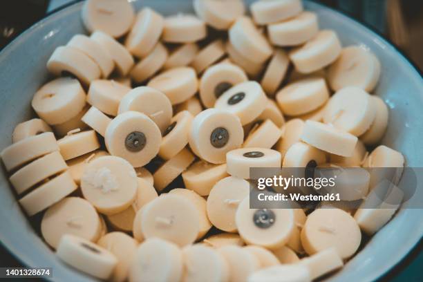 wax candles in blue container at cafe - tea light stock pictures, royalty-free photos & images