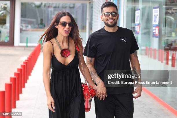 Tamara Gorro and Ezequiel Garay enter a store, on June 6 in Madrid, Spain.