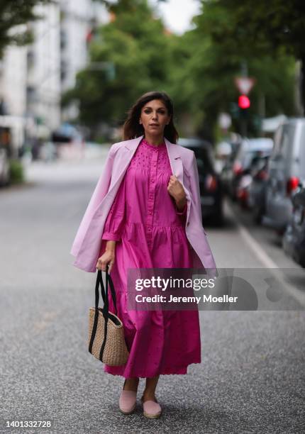 Anna Wolfers seen wearing a light pink blazer, a pink maxi dress with long sleeves, a bast basket shopper bag and light pink espadrilles on June 02,...