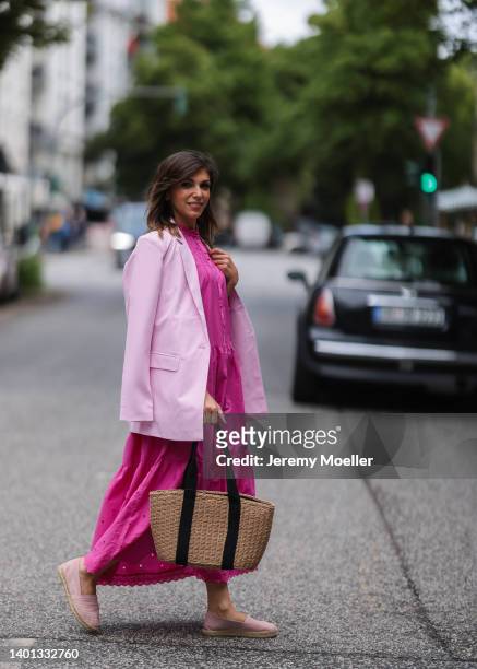 Anna Wolfers seen wearing a light pink blazer, a pink maxi dress with long sleeves, a bast basket shopper bag and light pink espadrilles on June 02,...