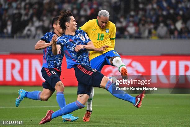 Neymar Jr. Of Brazil is blocked by Ko Itakura of Japan during the international friendly match between Japan and Brazil at National Stadium on June...