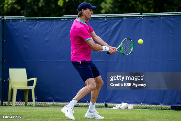 Andreas Seppi of Italy plays a backhand against Gijs Brouwer of the Netherlands during the Mens Singles Qualification match on Day 1 of the Libema...