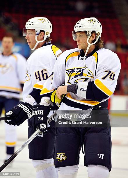 Brothers Andrei Kostitsyn and Sergei Kostitsyn of the Nashville Predators warm up before a game against the Carolina Hurricanes at the RBC Center on...