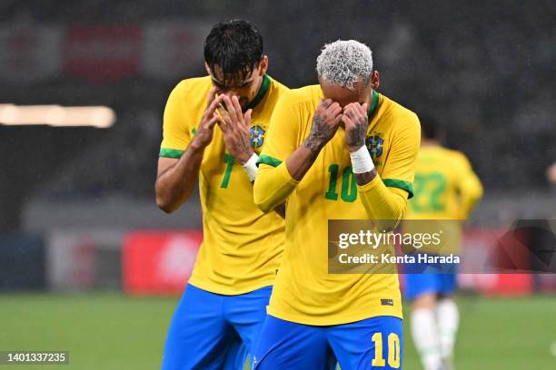 Neymar Jr. Of Brazil celebrates scoring his side's first goal with his teammate Lucas Paqueta during the international friendly match between Japan...