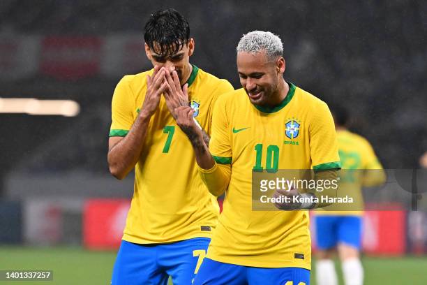 Neymar Jr. Of Brazil celebrates scoring his side's first goal with his teammate Lucas Paqueta during the international friendly match between Japan...