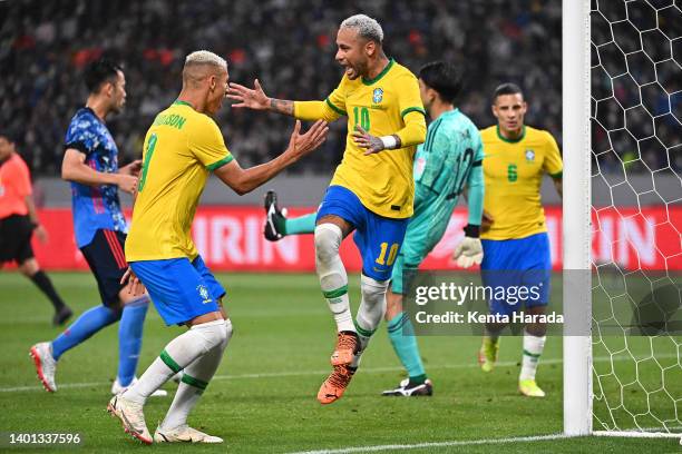 Neymar Jr. Of Brazil celebrates scoring his side's first goal with his teammate Richarlison during the international friendly match between Japan and...