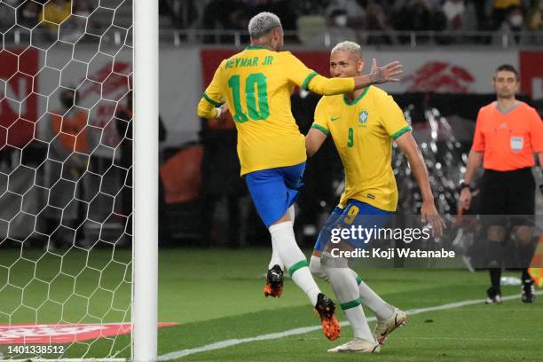 Neymar Jr. Of Brazil celebrates scoring his side's first goal with his teammate Richarlison during the international friendly match between Japan and...