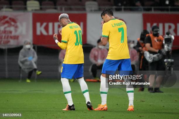 Neymar Jr. Of Brazil celebrates scoring his side's first goal with his teammate Lucas Paqueta during the international friendly match between Japan...
