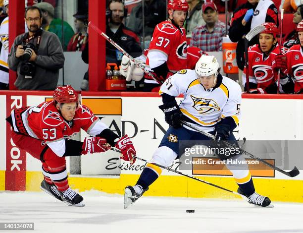 Jeff Skinner of the Carolina Hurricanes pokes the puck away from Gabriel Bourque of the Nashville Predators during play at the RBC Center on February...