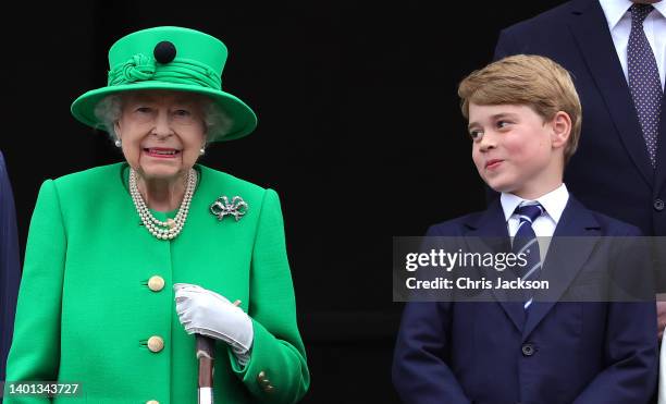 Queen Elizabeth II and Prince George of Cambridge on the balcony of Buckingham Palace during the Platinum Jubilee Pageant on June 05, 2022 in London,...