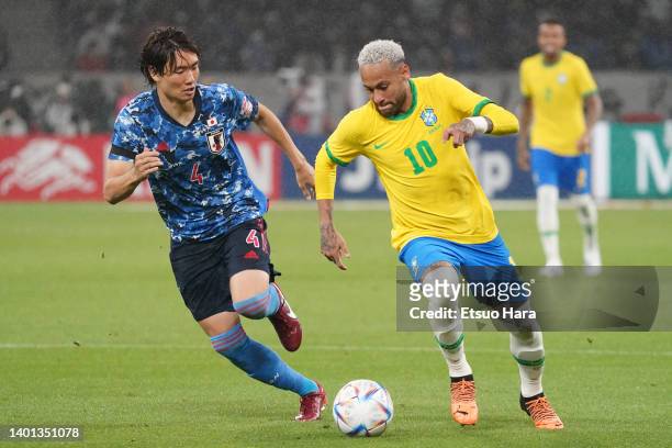 Neymar Jr. Of Brazil controls the ball under pressure of Ko Itakura of Japan during the international friendly match between Japan and Brazil at...