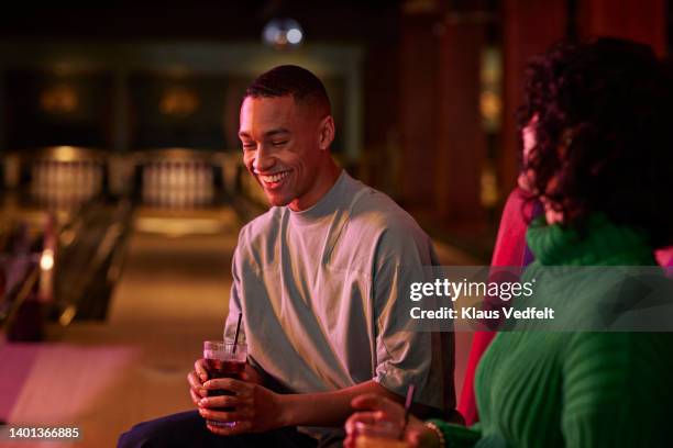 young man talking with female friend - mock turtleneck stock pictures, royalty-free photos & images