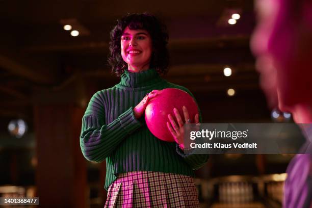 woman with ball at bowling alley - short skirt stock pictures, royalty-free photos & images