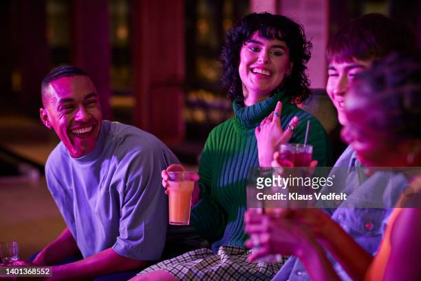 multiracial young friends having drinks - toned image 個照片及圖片檔