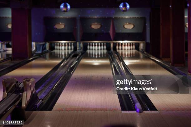 interior of bowling alley - bowlingbahn stock-fotos und bilder
